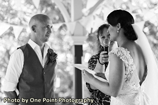 Picture of bride reading her vows to her groom